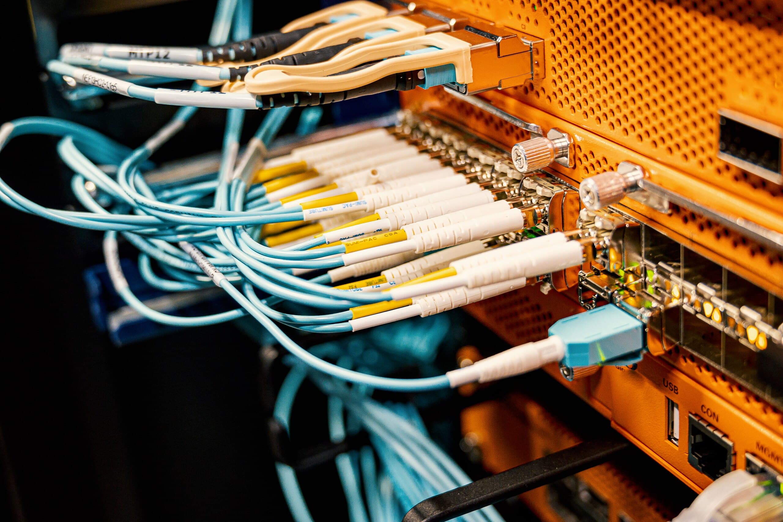Fiber optic cables connected to a network switch